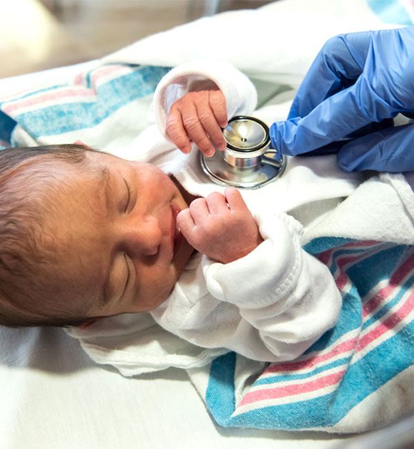 doctor-checking-a-newborn-royalty-free-image
